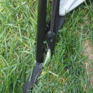 close up of tent pole and stake where canopy is attached for support