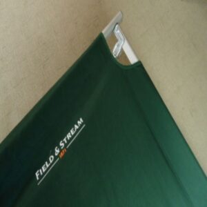 close up of corner of green cot with field stream logo